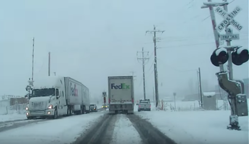 Keep your eye on the Oncoming FedEx Semi-trailer
