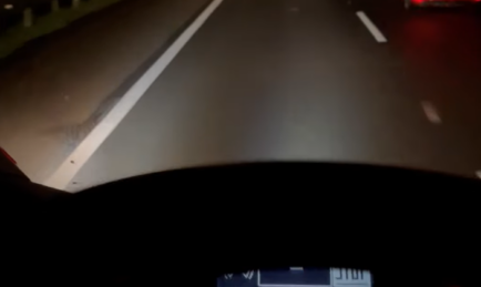 WATCH: Truck Driver “Shares” Headlights With Biker Riding in the Dark