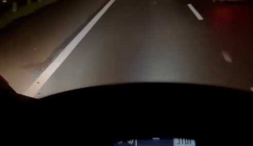 WATCH: Truck Driver “Shares” Headlights With Biker Riding in the Dark