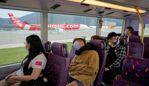 Hong Kongers Pay For “Bus Sleeping Tour” to Catch Some Shuteye