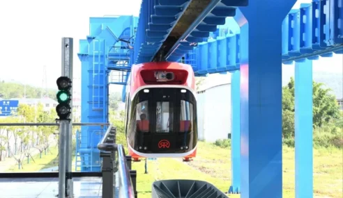 China Introduces Maglev “Sky Train” That Hangs From Its Rail